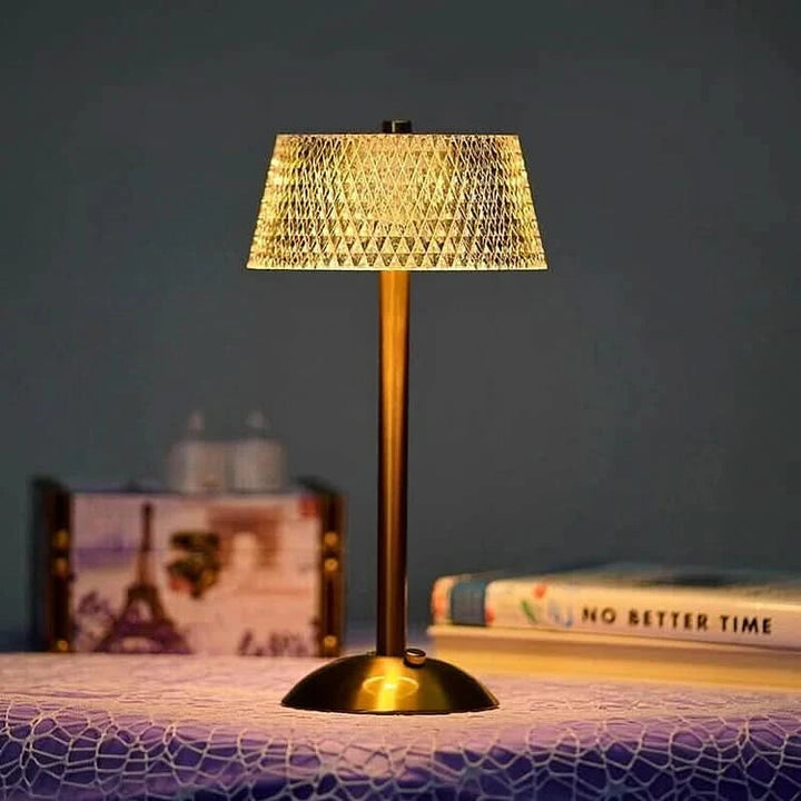 Crystal LED table lamp on wooden nightstand in bedroom