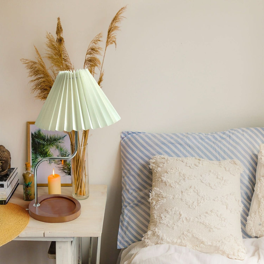 Vintage style pleated lamp with brown shade on wooden nightstand