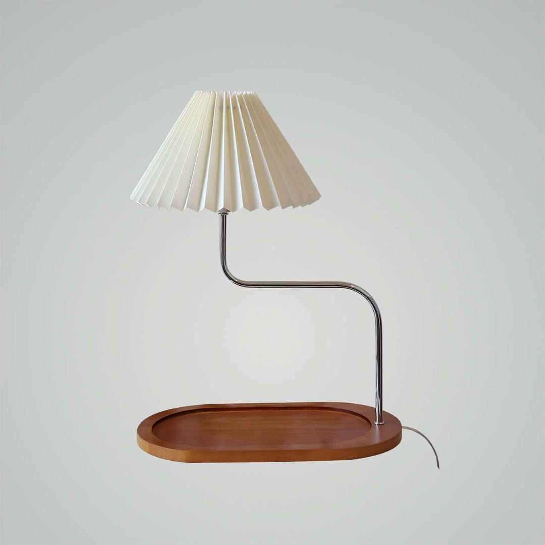 Green fabric shade pleated lamp on office desk